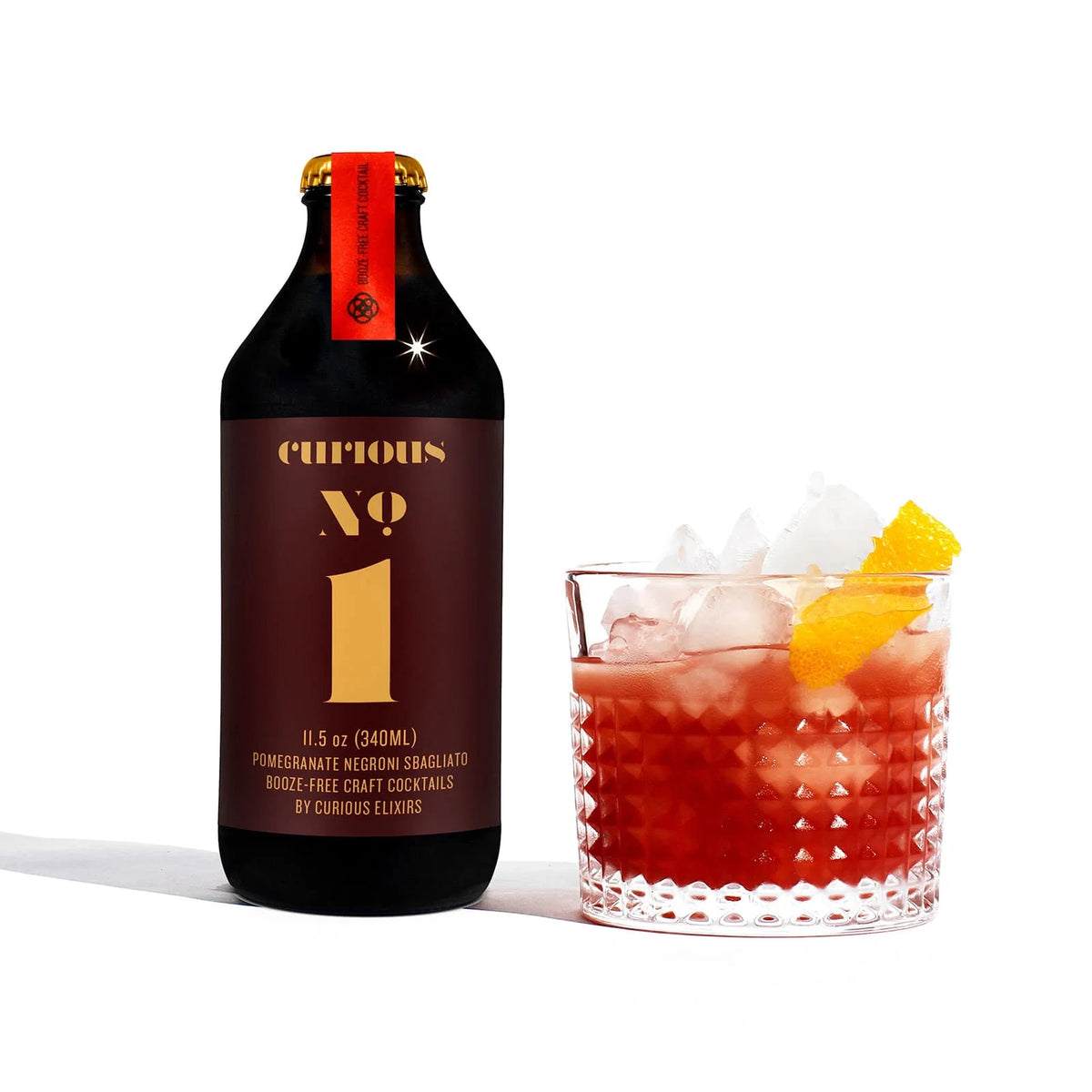 Curious No. 1 Curious Elixirs servido en copa — Negroni sin alcohol citrico amargo y botanico